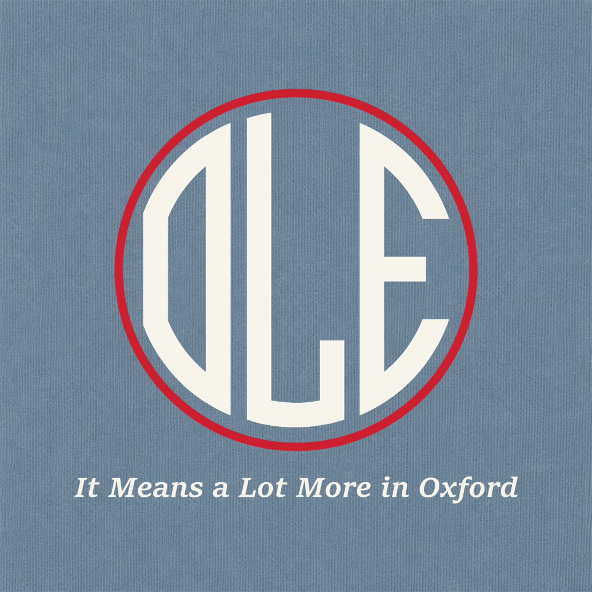 Close-up of Ole Miss red and ivory Oxford artwork on Blue Jean Comfort Colors fabric